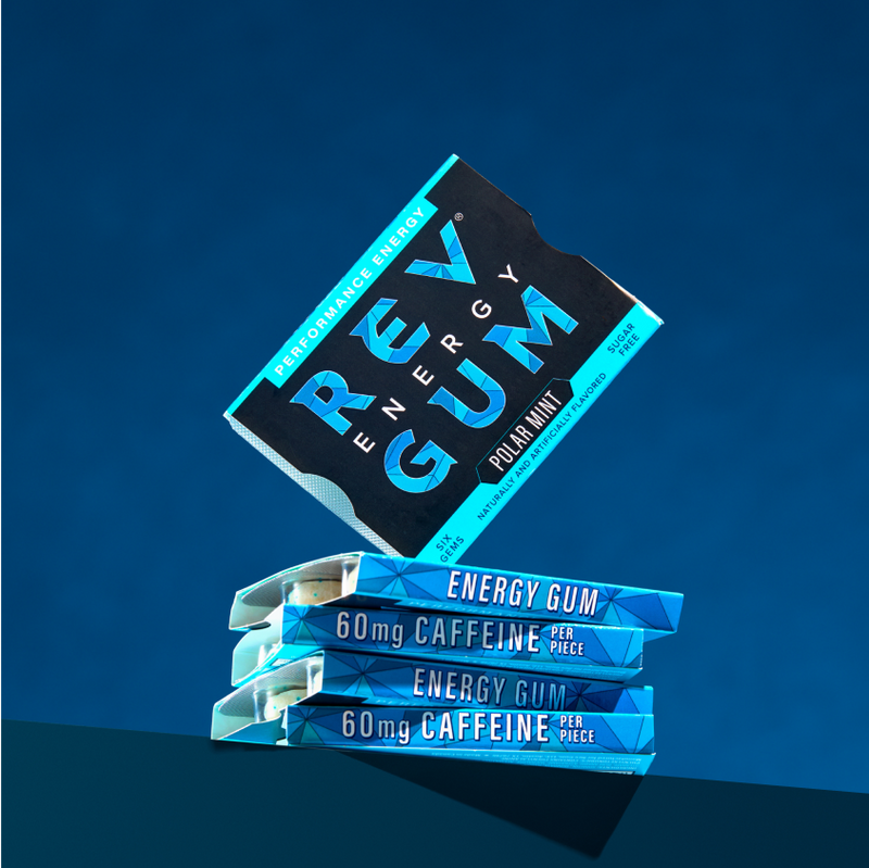 REV Energy Gum packaging on a blue background