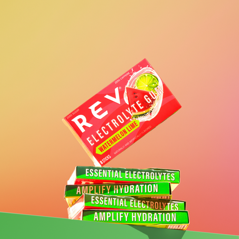 Stack of REVL electrolyte gum packets on a gradient background